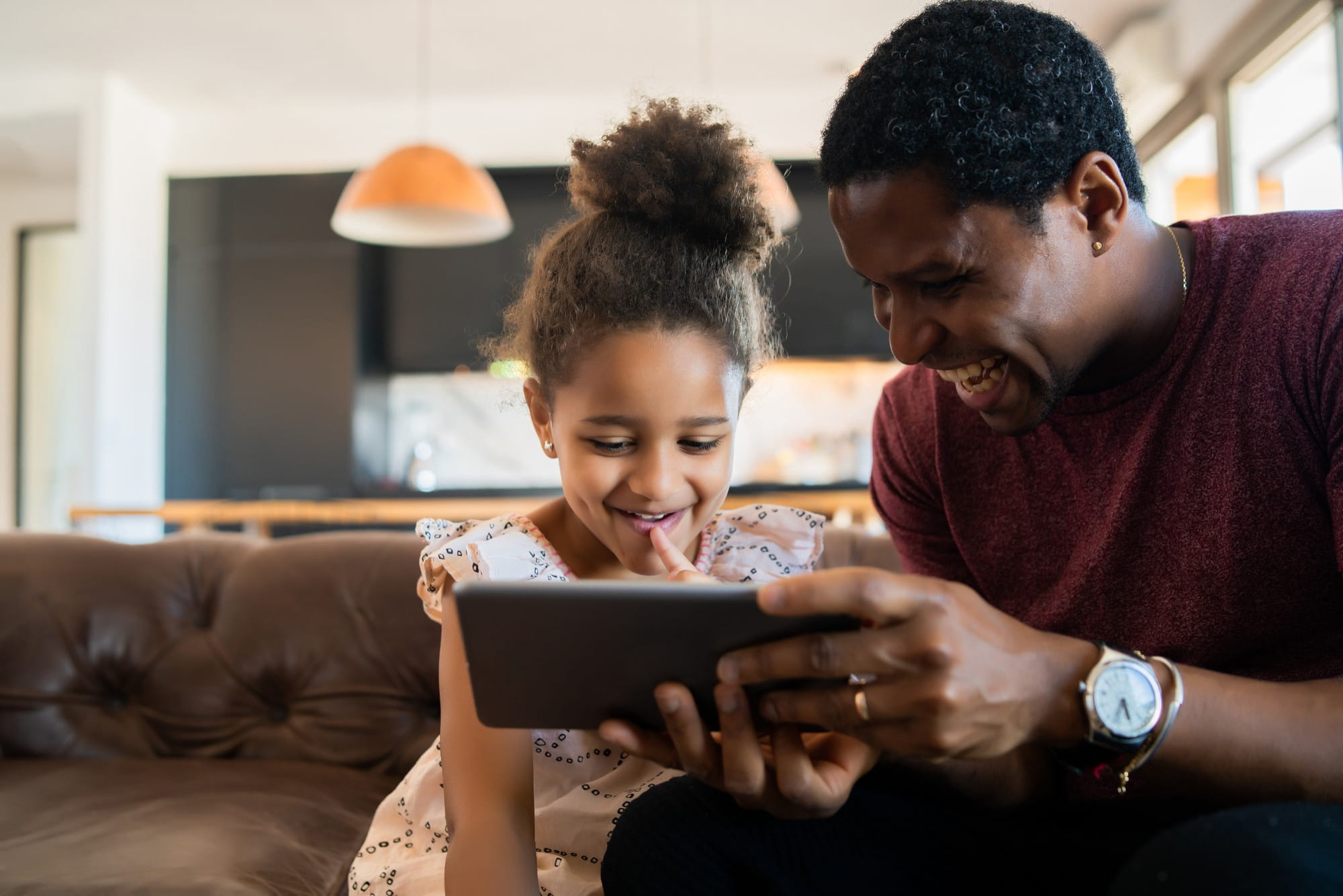 A parent and child learning together on LearnMate